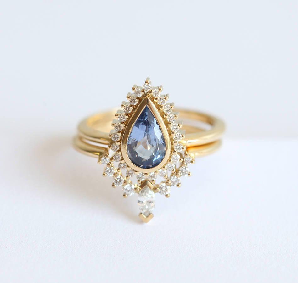 Birnenförmiger blauer Saphir-Verlobungsring mit weißem Diamant-Heiligenschein