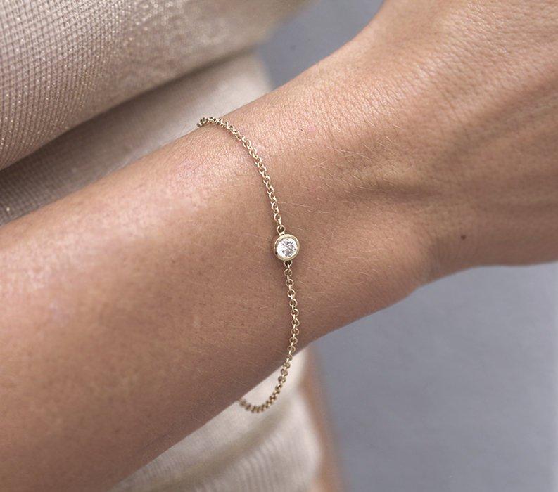 Goldkettenarmband mit rundem weißen Diamanten