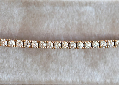 Diamantarmband aus 18-karätigem Roségold mit runden Diamanten im Brillantschliff.