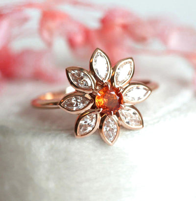 Orangefarbener runder Saphirring mit Diamant-Heiligenschein