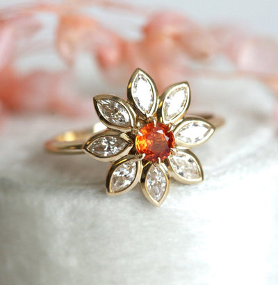 Orangefarbener runder Saphirring mit Diamant-Heiligenschein