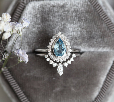 Birnen-Aquamarin-Ring, besetzt mit Diamant-Halo und Marquise-Band