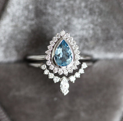 Birnen-Aquamarin-Ring, besetzt mit Diamant-Halo und Marquise-Band