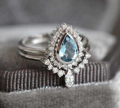 Birnen-Aquamarin-Ring, besetzt mit Diamant-Halo und Marquise-Band