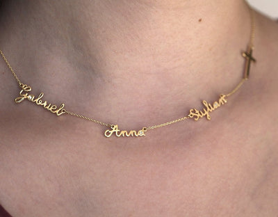 Goldkette mit drei personalisierten Namen und Kreuz